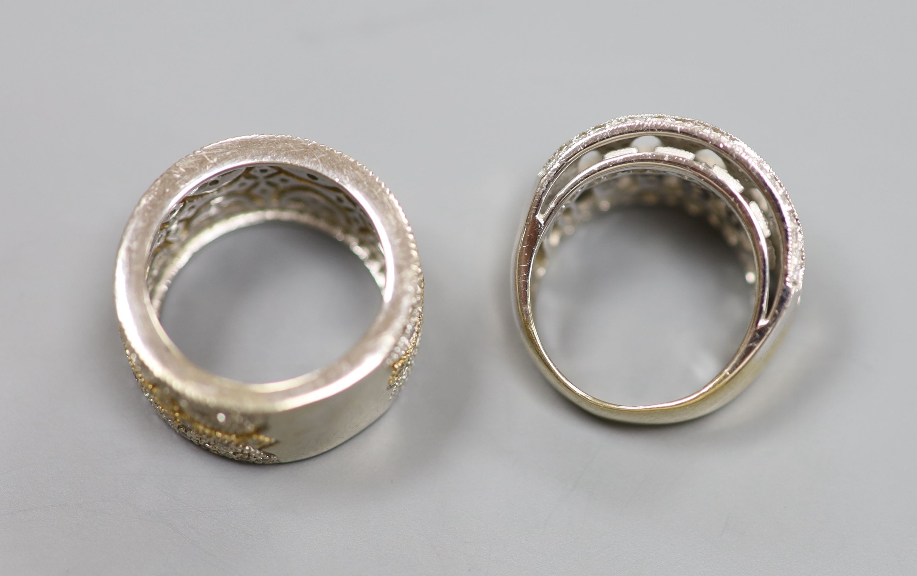 Two modern pierced yellow and white metal, diamond chip cluster rings, sizes K M, gross weight 18.9 grams.